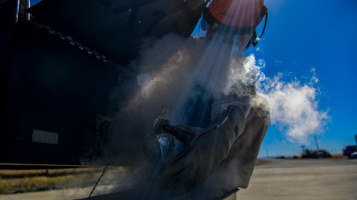 Airman 1st Class Randy Willis 9th Logistic Readiness Squadron cryogenics technician, carefully handles Liquid Oxygen (LOX) at Beale Air Force Base, California, July 21, 2022.