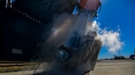 Airman 1st Class Randy Willis 9th Logistic Readiness Squadron, cryogenics technician, purges a hose at Beale Air Force Base, California, July 21, 2022.