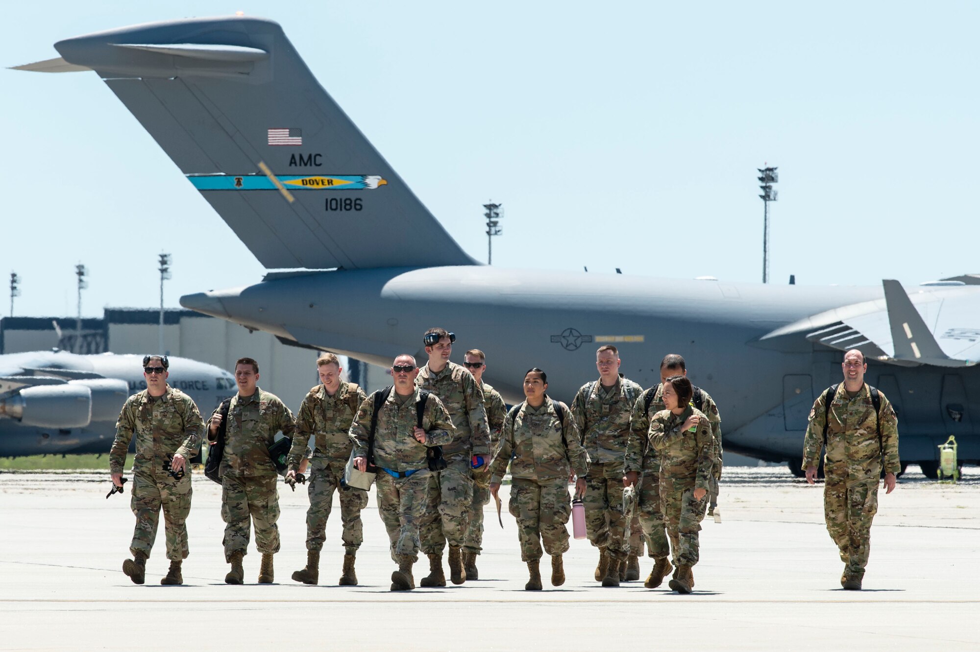 Team Dover members arrive at a simulated deployment location during Liberty Eagle Readiness Exercise 2022 at Dover Air Force Base, Delaware, July 11, 2022. The 436th and 512th Airlift Wings tested their ability to generate, employ and sustain airpower across the world in a simulated contested and degraded operational environment. (U.S. Air Force photo by Roland Balik)