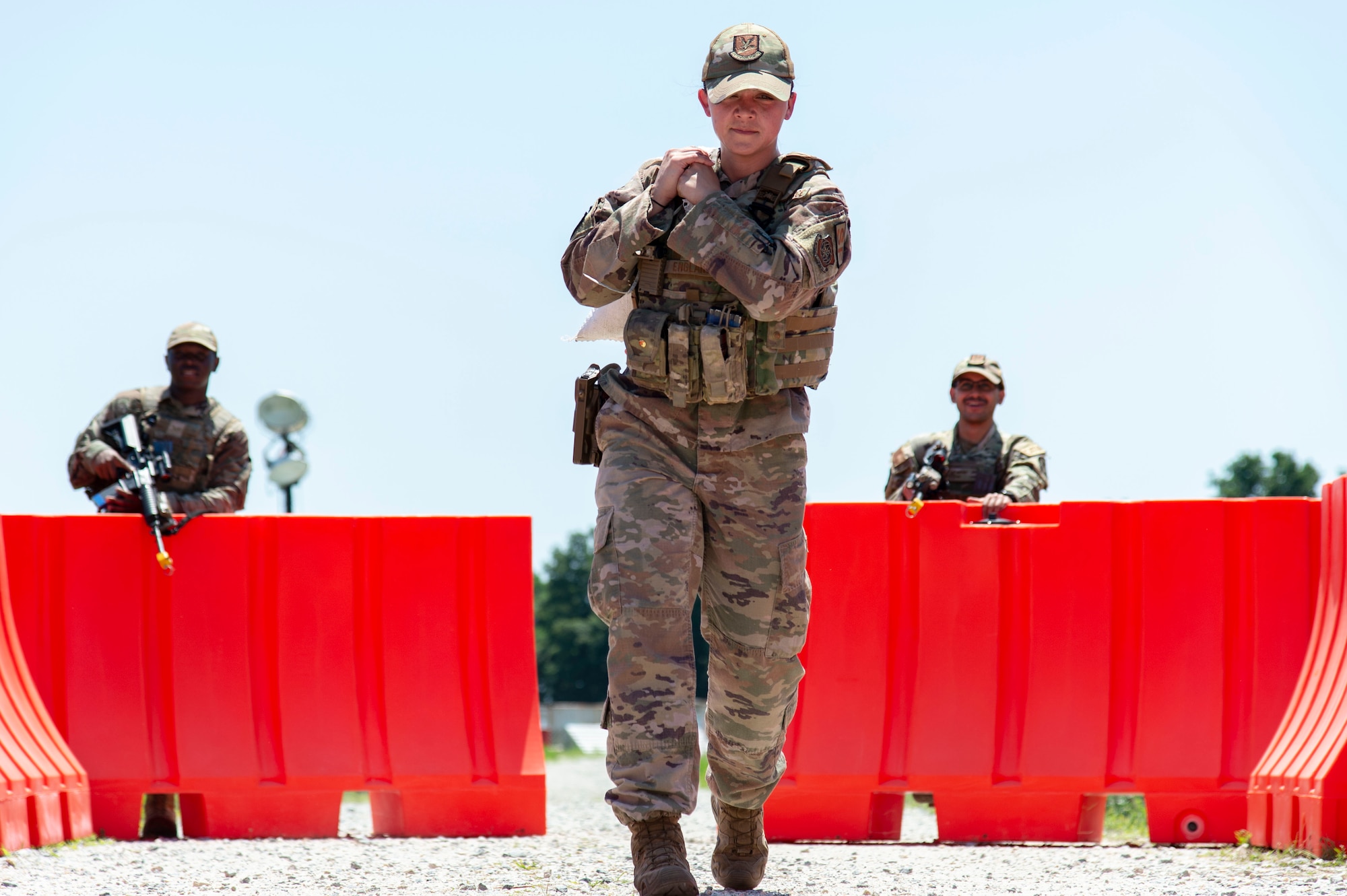 Staff Sgt. Chloe England, 436th Security Forces Squadron base defense operations center controller, carries a sandbag at a simulated forward operating base during Liberty Eagle Readiness Exercise 2022 at Dover Air Force Base, Delaware, July 12, 2022. The 436th and 512th Airlift Wings tested their ability to generate, employ and sustain airpower across the world in a simulated contested and degraded operational environment. (U.S. Air Force photo by Roland Balik)