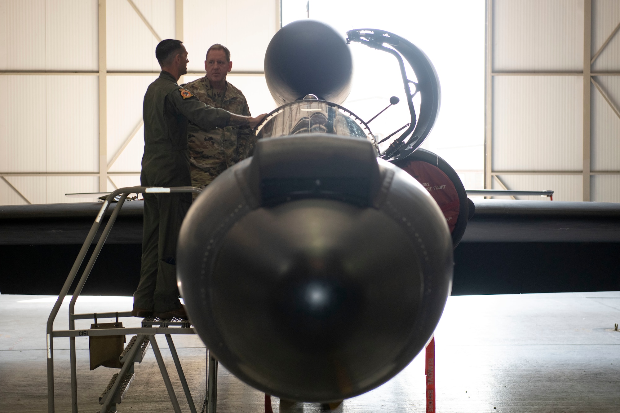 U.S. Air Force Lt. Col. Christopher “Scrat” Pridgen, left, 99th Expeditionary Reconnaissance Squadron director of operations, provides a tour of the U-2 Dragon Lady to Gen. James B. Hecker, right, U.S. Air Forces in Europe and Air Forces Africa commander, at Royal Air Force Fairford, England, July, 18, 2022. During his first visit to the 501st Combat Support Wing as the USAFE-AFAFRICA commander, Hecker met with several Airmen and received briefings about the wing’s mission and capabilities. (U.S. Air Force photo by Senior Airman Jennifer Zima)