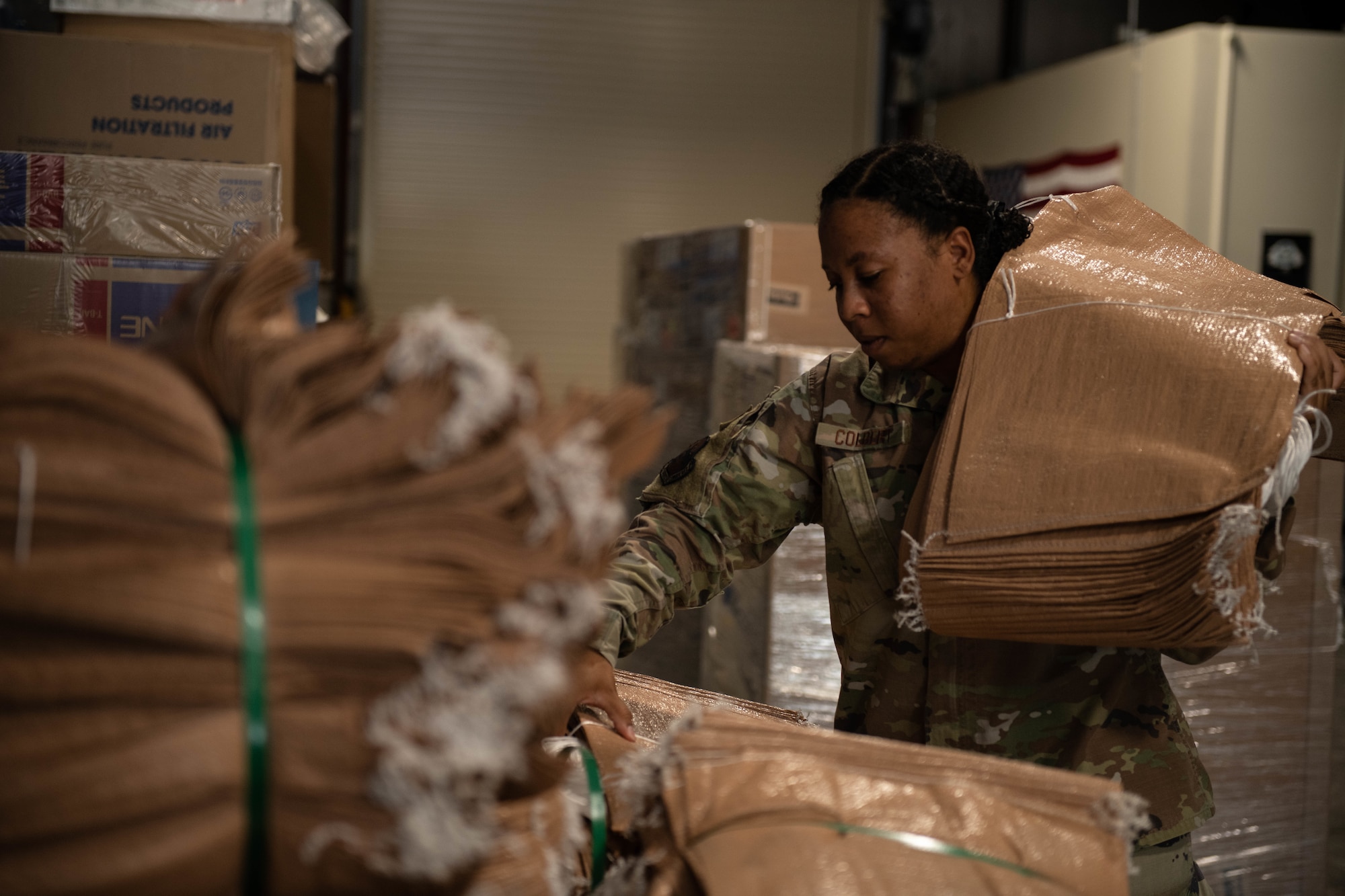 Staff Sgt. Sadie Colbert, 8th Fighter Wing public affairs specialist, grabs new sandbags from the U-Fix-It store at Kunsan Air Base, Republic of Korea, July 20, 2022. The store offers Airmen the option to fix minor repairs themselves without the need of submitting a work order request through the 8th Logistics Readiness Squadron. (U.S. Air Force photo by Senior Airman Shannon M. Braaten)