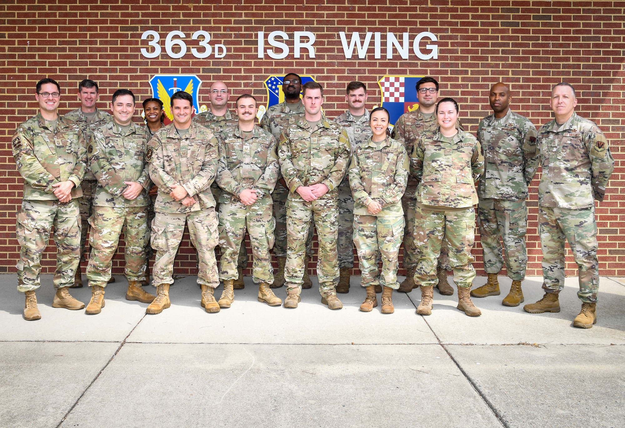 A group of Airmen pose for a group photo.