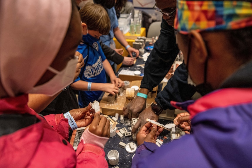 Students participate in a hands-on workshop at the Office of Naval Research exhibit during the STEM Expo at National Harbor, Md.