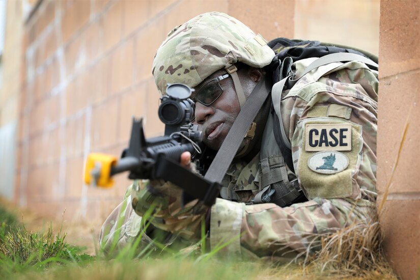 Spc. Jerome Shockley, a plumber assigned to the 160th Engineer Company, Delaware Army National Guard provides suppressive fire from cover as his squad conducts a dismounted patrol through the Combined Arms Collective Training Facility at Fort Indiantown Gap (FTIG), Pa. July 12, 2022. The company is conducting annual training at FTIG in preparation for an upcoming deployment.