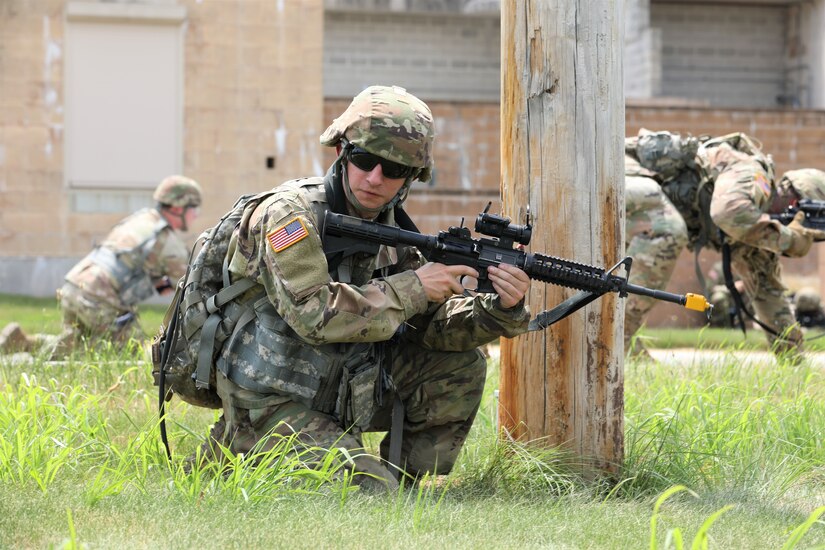 Staff Sgt. Kyler Saxon (center) and other Soldiers with the 160th Engineer Company, Delaware Army National Guard train on reacting to threats while on patrol including IEDs July 12 as part of their preparations for an upcoming deployment. This training is part of the company’s annual training that they are conducting at Fort Indiantown Gap, Pa.