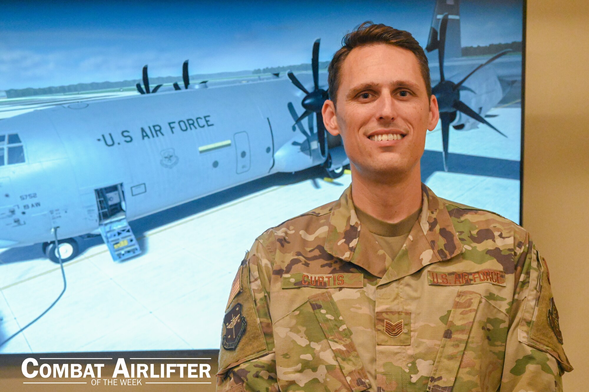 A man in uniform poses for a photo.