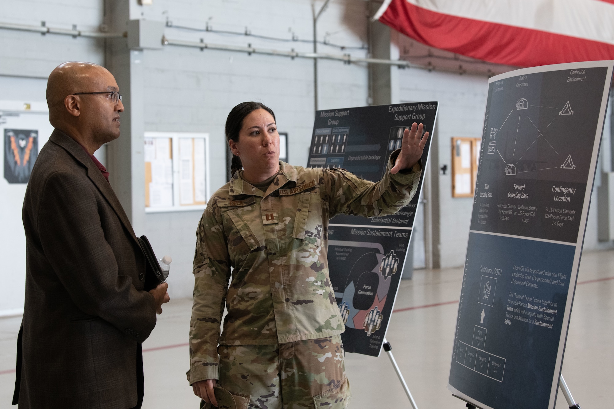 U.S. Air Force Capt. Melissa Cecil, a Mission Sustainment Team member, speaks with Dr. Sandeep Mulgund, senior advisor to the Deputy Chief of Staff for Operations of the U.S. Air Force at Hurlburt Field, Florida, July 20, 2022. The MST works to establish forward operating bases in austere locations by providing initial site security, receiving cargo and personnel and setting up shelter.