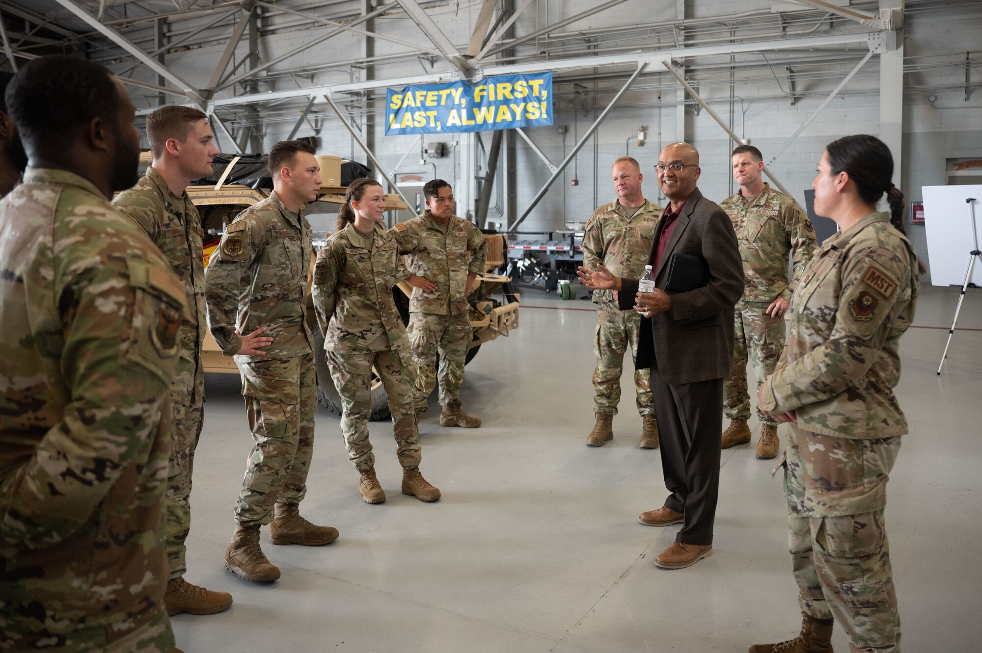 Dr. Sandeep Mulgund, senior advisor to the Deputy Chief of Staff for Operations of the U.S. Air Force speaks with Airmen assigned to Mission Sustainment Team at Hurlburt Field, Florida, July 20, 2022. The MST works to establish forward operating bases in austere locations by providing initial site security, receiving cargo and personnel and setting up shelter.