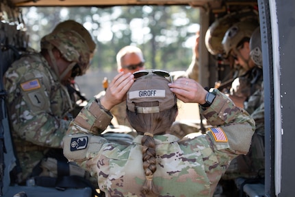 U.S. Army Soldiers with the 404th Civil Affairs Battalions (Airborne) aboard a Black Hawk (UH-60) helicopter during a cold load exercise with the 8th Battalion 229th regiment, during Operation Viking at Joint Base Cape Cod, Mass., July 20, 2022. Operation Viking is an intense joint task force exercise designed to prepare Soldiers with realistic training simulating deployment of civil affairs units in direct support of contigency operation in Africa. (U.S. Army photo by Sgt. Arbishua Rojas)