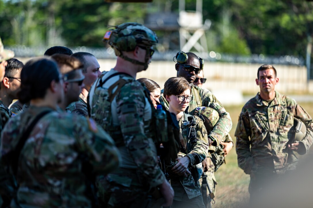 U.S. Army Soldiers with the 404th Civil Affairs Battallion receive instruction of cold load procedures of a Black Hawk (UH-60) Helicopter during Operation Viking at Joint Base Cape Cod, Mass., July 20, 2022. Operation Viking is an intense joint task force exercise designed to prepare Soldiers with realistic training simulating deployment of civil affairs units in direct support of a contingency operation in Africa. (U.S. Army Photo by Staff Sgt. Keith Thornburgh)