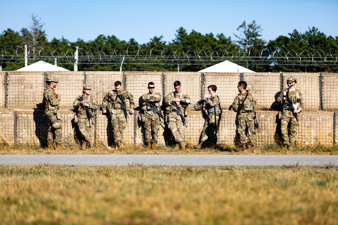 U.S. Army Soldiers with the 404th Civil Affairs Battallion await rotation during cold load training during Operation Viking at Joint Base Cape Cod, Mass., July 20, 2022. Operation Viking is an intense joint task force exercise designed to prepare Soldiers with realistic training simulating deployment of civil affairs units in direct support of a contingency operation in Africa. (U.S. Army Photo by Staff Sgt. Keith Thornburgh)