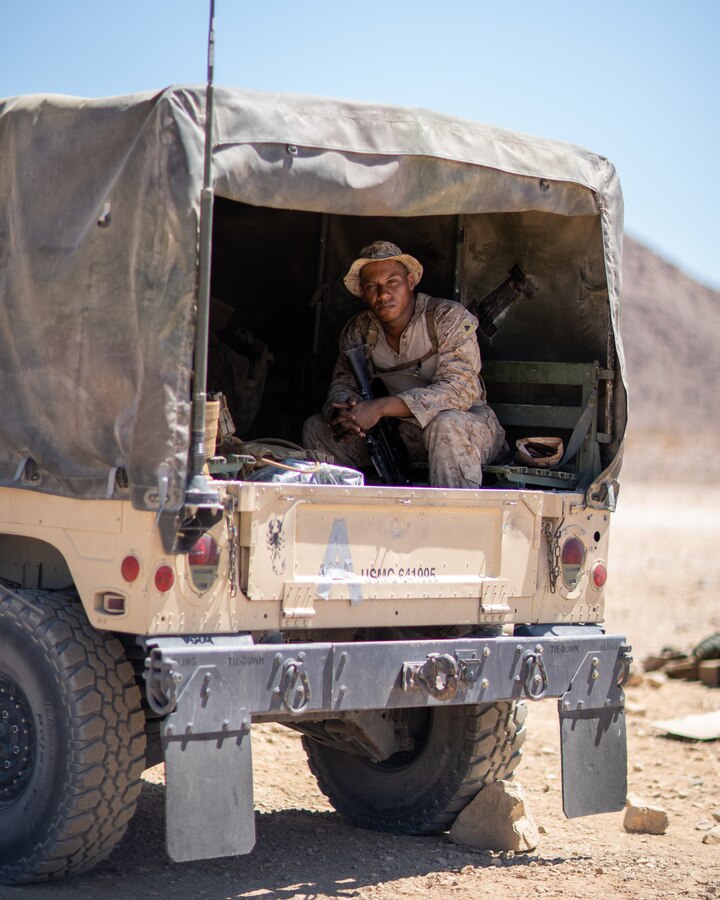 U.S. Marine Corps Cpl. Campbell Danavan, a motor vehicle operator with Marine Air Ground Task Force 23, poses for a portrait during Integrated Training Exercise (ITX) 4-22, at Marine Corps Air-Ground Combat Center, Twentynine Palms, Calif., July 19, 2022. Danavan, from Houma, Louisiana, repairs and maintains offshore equipment as a civilian and serves with truck company, 23rd Marine Regiment.



"I get a feeling of accomplishment. I can provide Marines with chow, their water bulls, everything they need for their training; I bring them to where they need to be. To be honest it just feels nice to be able to know that they're counting on you."



Marines and Sailors with MAGTF-23 maintain various civilian careers while continuing to answer their call to service in the Marine Corps Reserve. (U.S. Marine Corps photo by Cpl. James Stanfield)