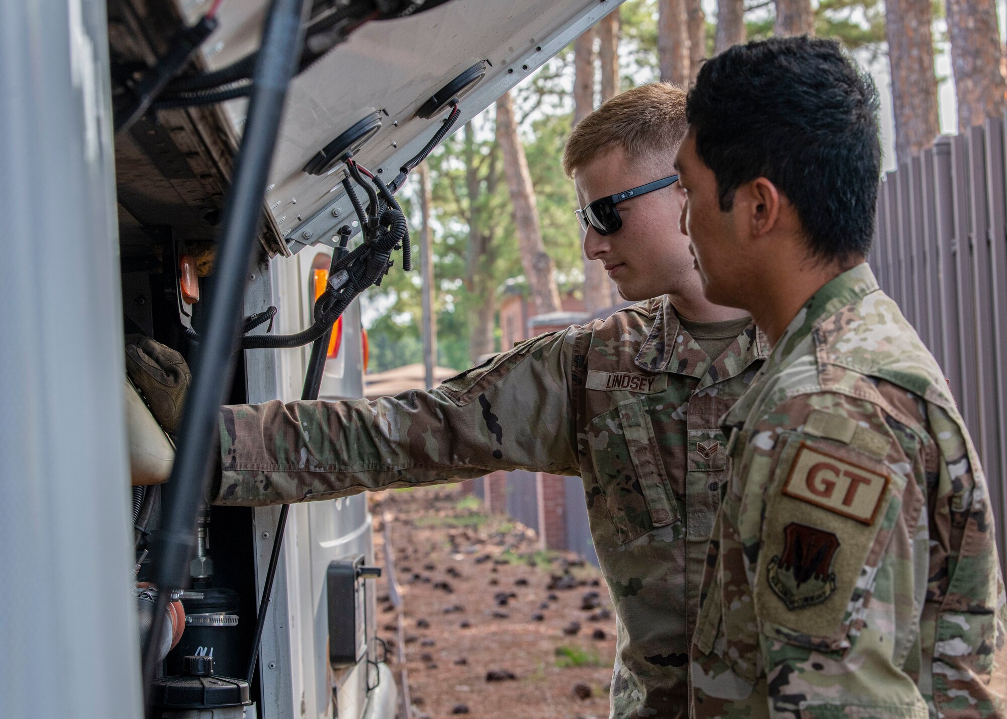 Senior Airman Remington Lindsey, 4th Logistics Readiness Squadron ground

transportation trainer, inspects a bus engine with Airman 1st Class Carl

Bautista, 4th LRS ground transportation operator, at Seymour Johnson Air

Force Base, North Carolina, July 14, 2022. The 4th LRS provides logistics

support for F-15E Strike Eagle aircraft and supports units across the base.

(U.S. Air Force photo by Airman 1st Class Sabrina Fuller.)
