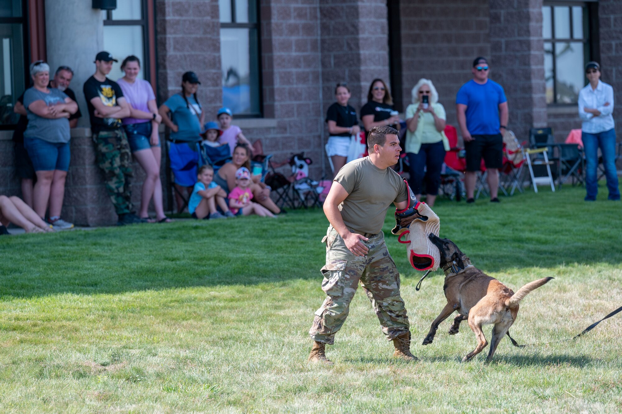 Military Working Dog handler teams from the 341st Missile Wing perform a K-9 demonstration during the Montana’s Military Open House “Flight Over the Falls” at Montana Air National Guard Base, Great Falls, Montana, July 24, 2022.