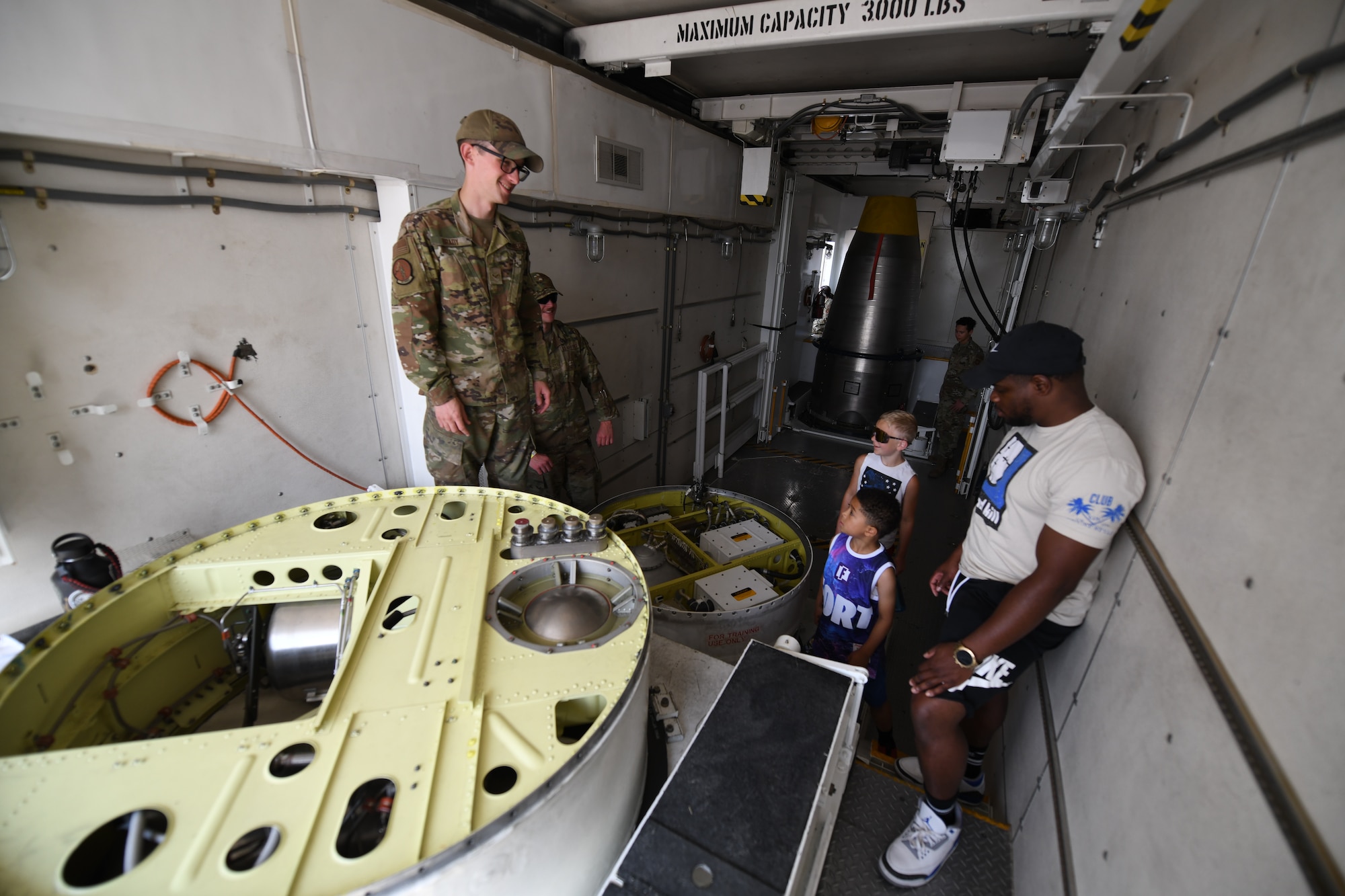 Technicians from the 341st Maintenance Group explain the interior of a Payload Transporter III during Montana's Military Open House "Flight over the Falls" at Montana Air National Guard Base, Great Falls, Montana, July 24, 2022.