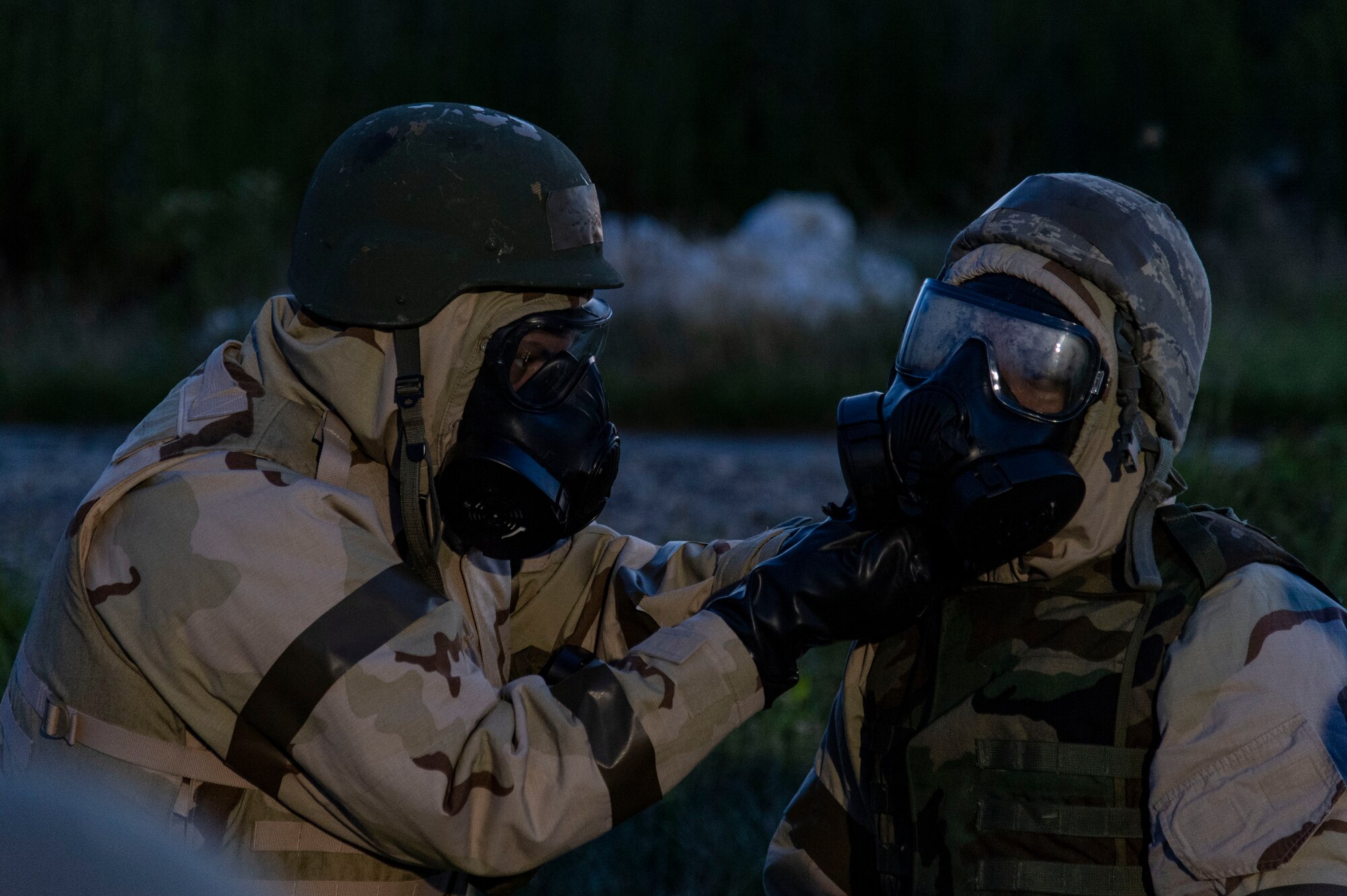 Team Dover members help each other don training protective gear prior to a simulated attack at a forward operating base during Liberty Eagle Readiness Exercise 2022 at Dover Air Force Base, Delaware, July 13, 2022. The 436th and 512th Airlift Wings tested their ability to generate, employ and sustain airpower across the world in a contested and degraded operational environment. (U.S. Air Force photo by Roland Balik)Team Dover members help each other don training protective gear prior to a simulated attack at a forward operating base during Liberty Eagle Readiness Exercise 2022 at Dover Air Force Base, Delaware, July 13, 2022. The 436th and 512th Airlift Wings tested their ability to generate, employ and sustain airpower across the world in a contested and degraded operational environment. (U.S. Air Force photo by Roland Balik)