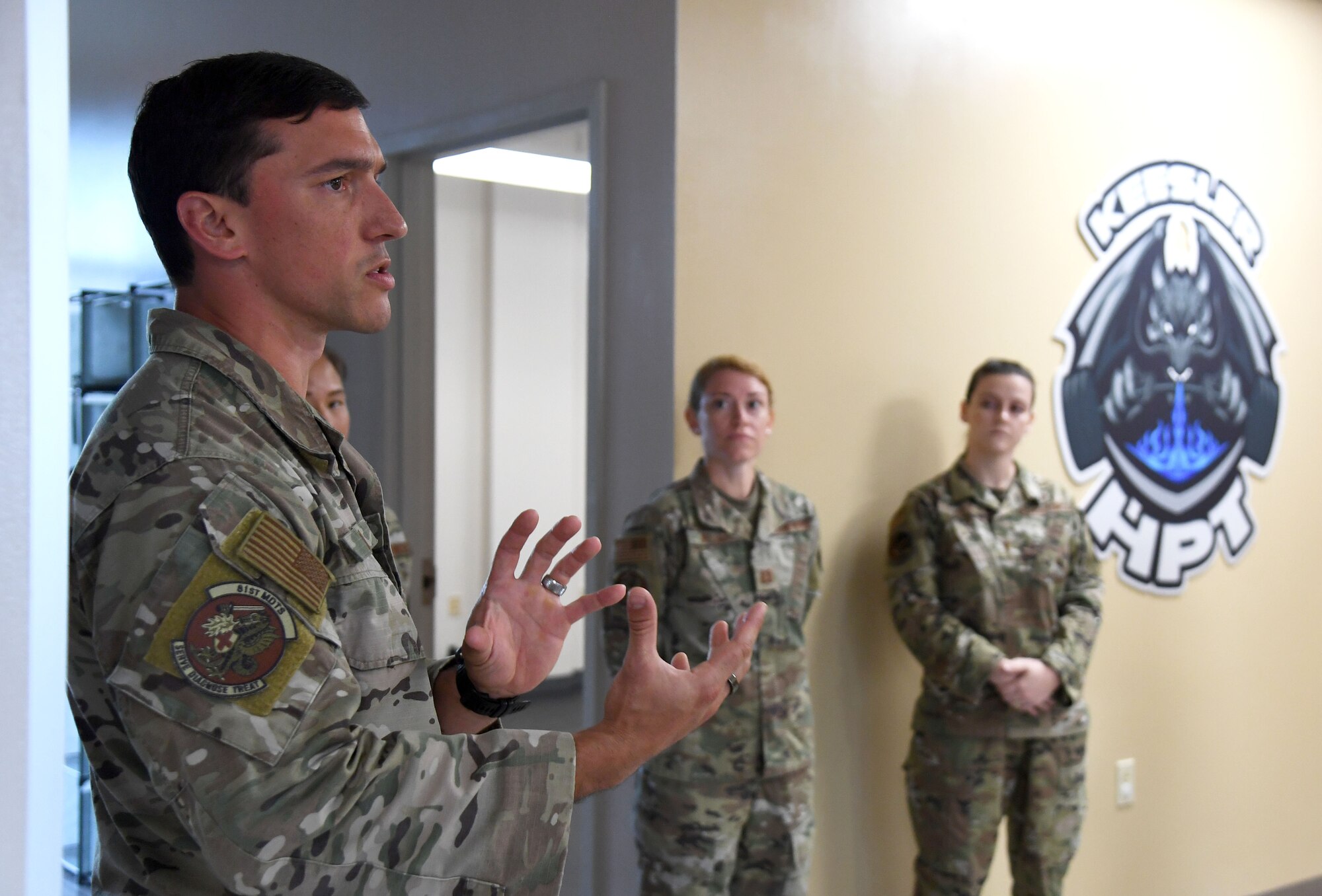 U.S. Air Force Master Sgt. Steven Coon, 81st Diagnostic and Therapeutics Squadron human performance training center program manager, briefs base leadership on the Human Performance Training Center capabilities at Keesler Air Force Base, Mississippi, July 25, 2022. The purpose of the center is to develop healthy and resilient Airmen that are always operational and maintain a high level of readiness by providing participants with the tools, resources and knowledge needed to create healthy and sustainable habits. (U.S. Air Force photo by Kemberly Groue)