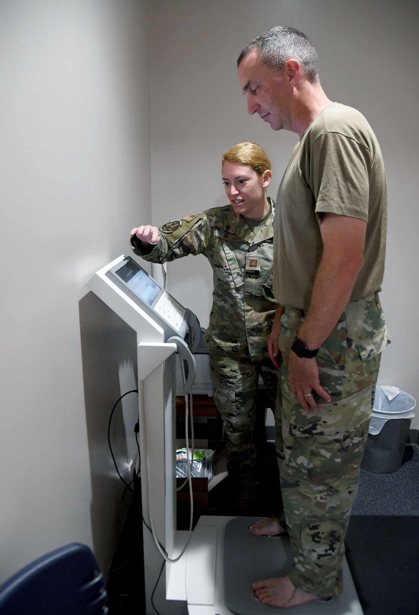 U.S. Air Force Capt. Kathryn Welch, 81st Diagnostic and Therapeutics Squadron nutritional medicine flight commander, assists Col. Christopher Estridge, 81st Medical Group commander, with using the In Body 770 equipment to collect anthropometrics inside the Human Performance Training Center at Keesler Air Force Base, Mississippi, July 25, 2022. The purpose of the center is to develop healthy and resilient Airmen that are always operational and maintain a high level of readiness by providing participants with the tools, resources and knowledge needed to create healthy and sustainable habits. (U.S. Air Force photo by Kemberly Groue)