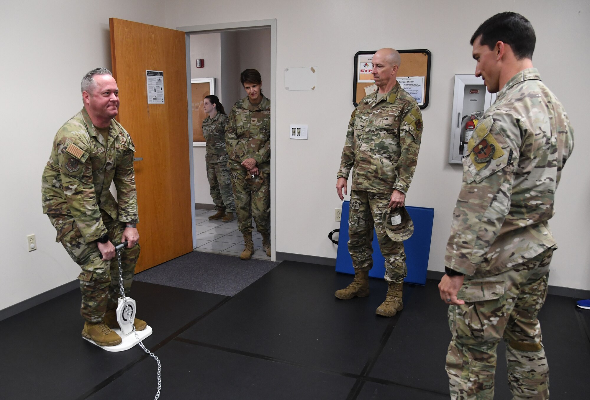 U.S. Air Force Chief Master Sgt. Jeremy Phillips, 81st Training Group senior enlisted leader, uses a grip dynameter to assess maximum strength during a base leadership immersion tour inside the Human Performance Training Center at Keesler Air Force Base, Mississippi, July 25, 2022. The purpose of the center is to develop healthy and resilient Airmen that are always operational and maintain a high level of readiness by providing participants with the tools, resources and knowledge needed to create healthy and sustainable habits. (U.S. Air Force photo by Kemberly Groue)