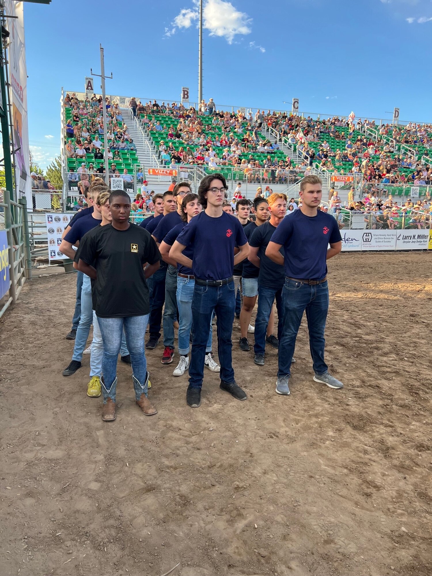 Delayed enlistment program members in formation at the Ogden Pioneer Days Rodeo opening ceremony July 22, 2022, before assisting in unfurling and displaying “The Major,” a giant American flag in Ogden, Utah.