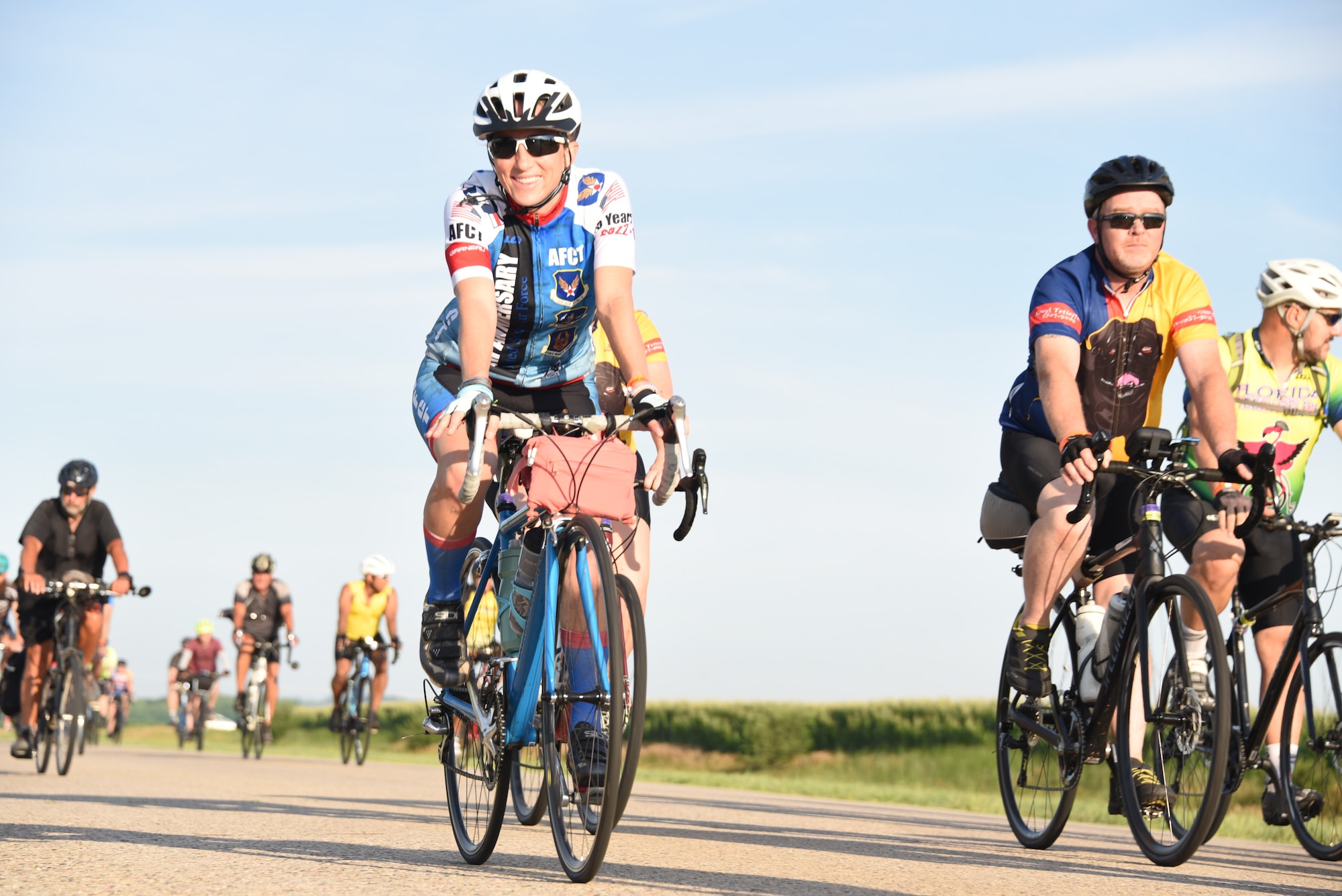 AFCT member rides in a crowd of cyclists