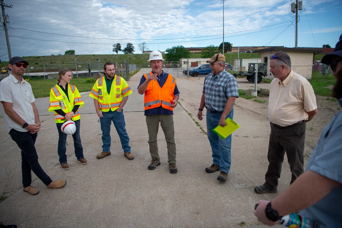 Members from the Special Projects Branch Fuels Section, Defense Fuels Resident Office, and the Petroleum, Oil, Lubricant Mandatory Center of Expertise Engineering Support Branch, U.S. Army Corps of Engineers, Omaha District, are briefed by a contractor during a commissioning inspection at Offutt Air Force Base, Neb., June 22, 2022.