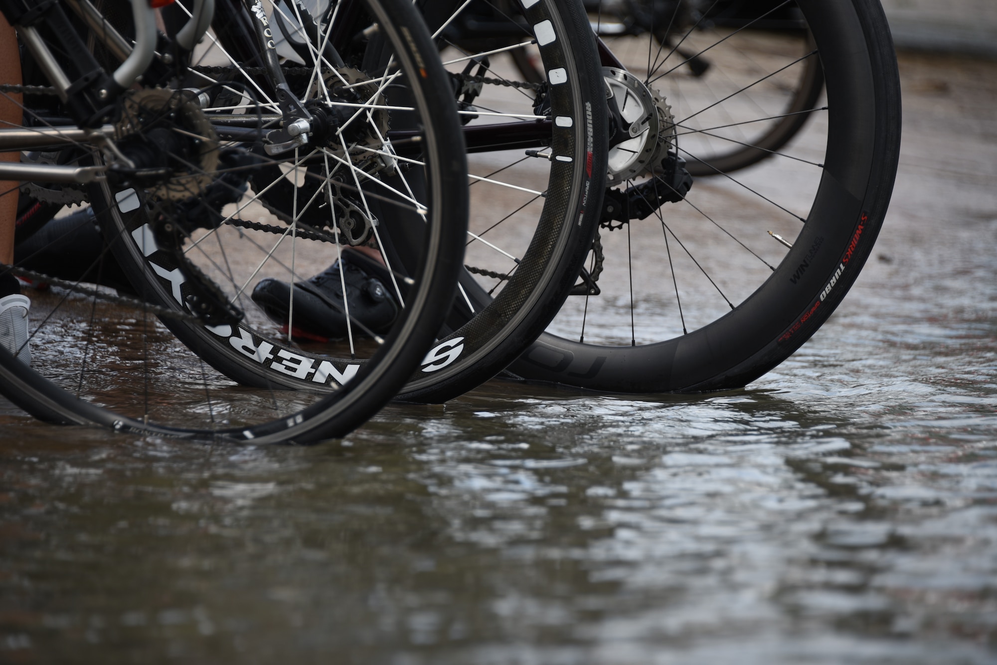 Bicycle tires are dipped into water