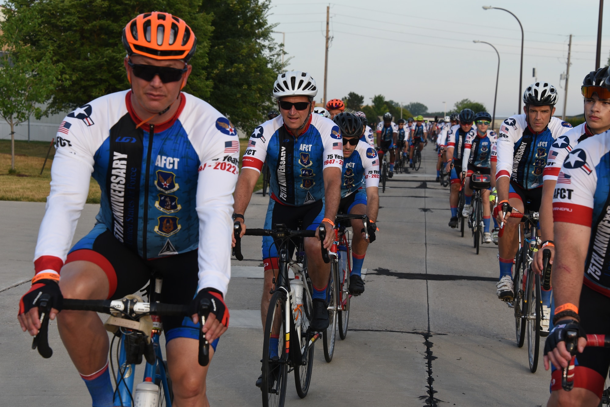 AFCT members ride down a road