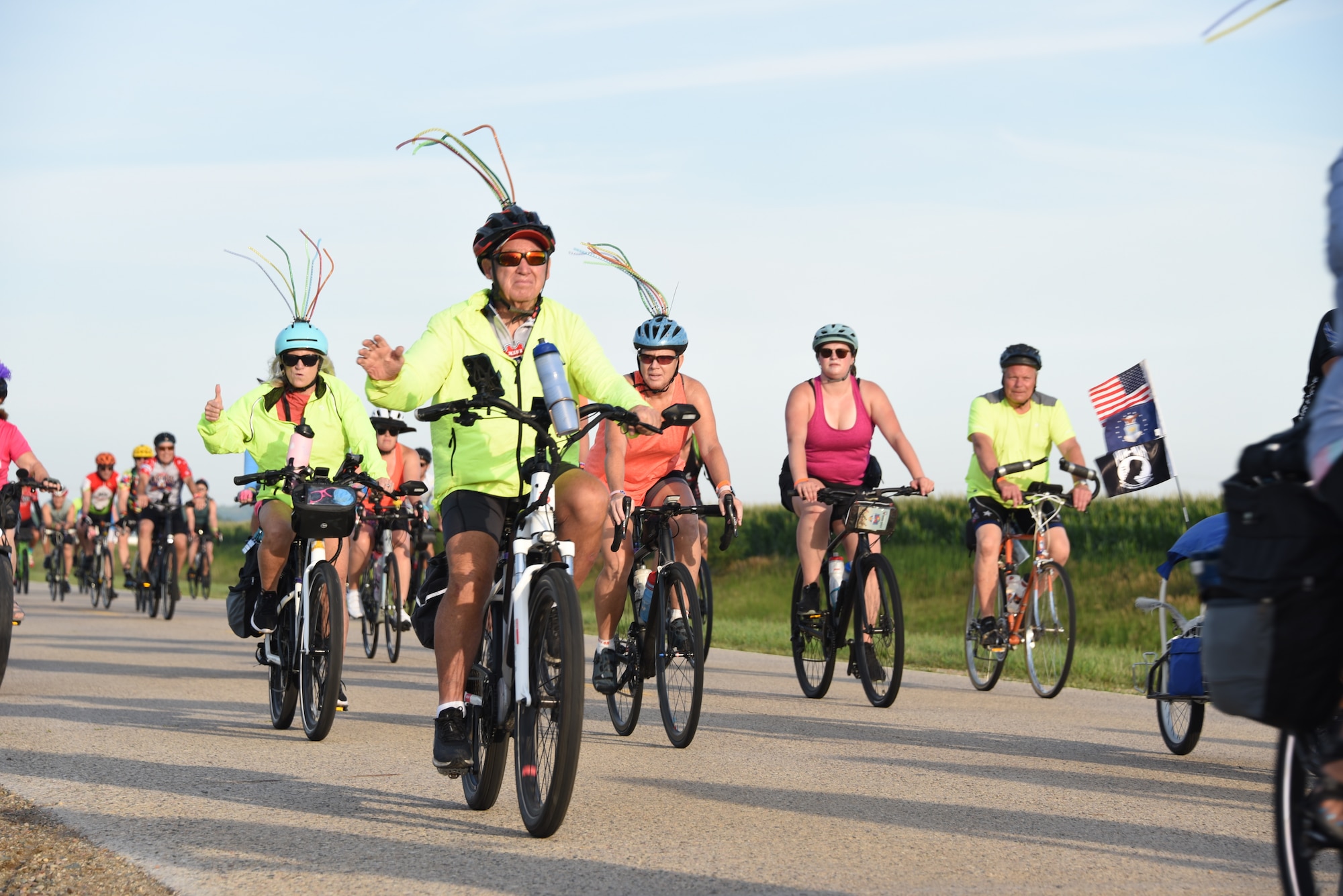 RAGBRAI Riders ride down a road