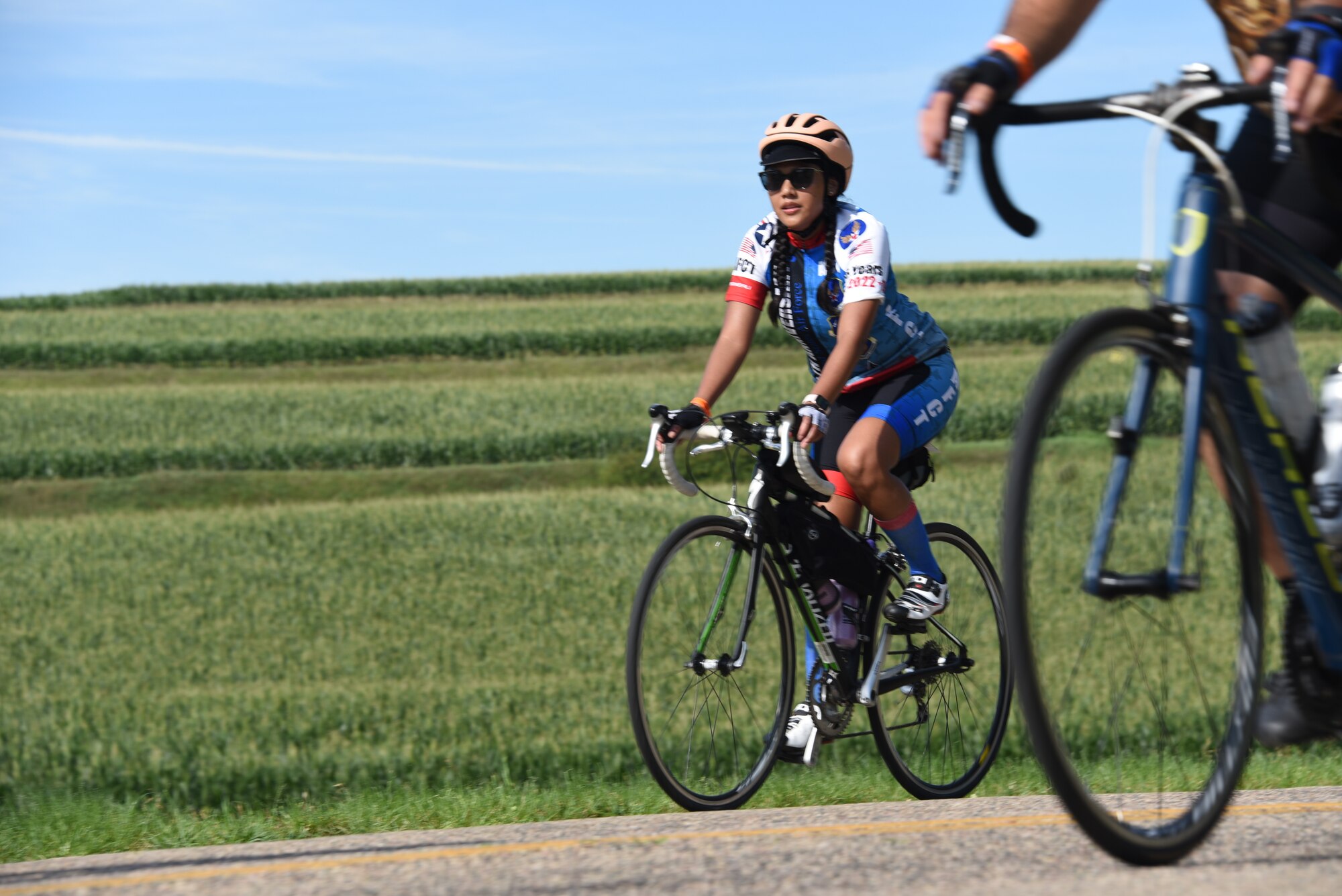 AFCT member rides by a field