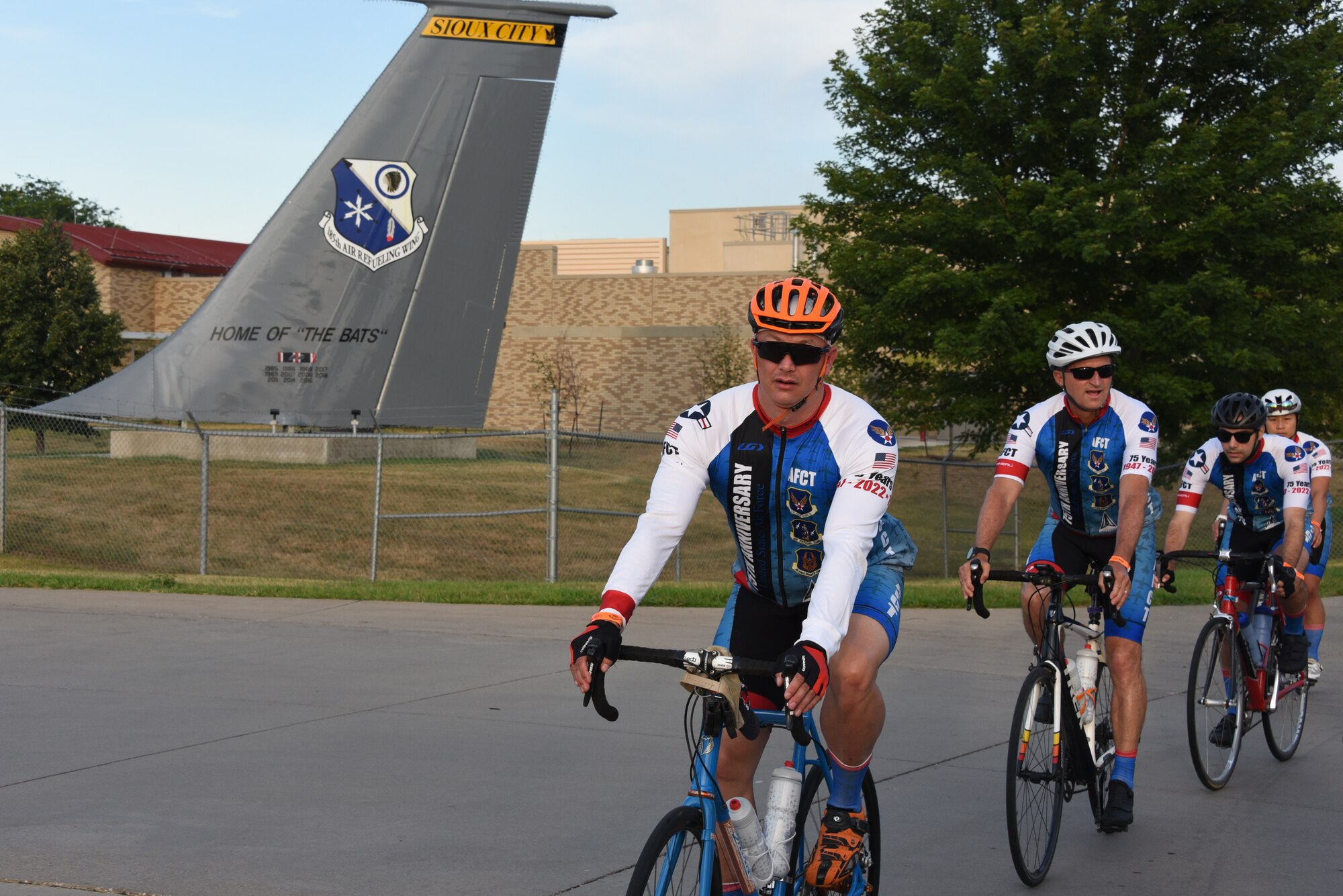 AFCT members ride past KC-135 tail