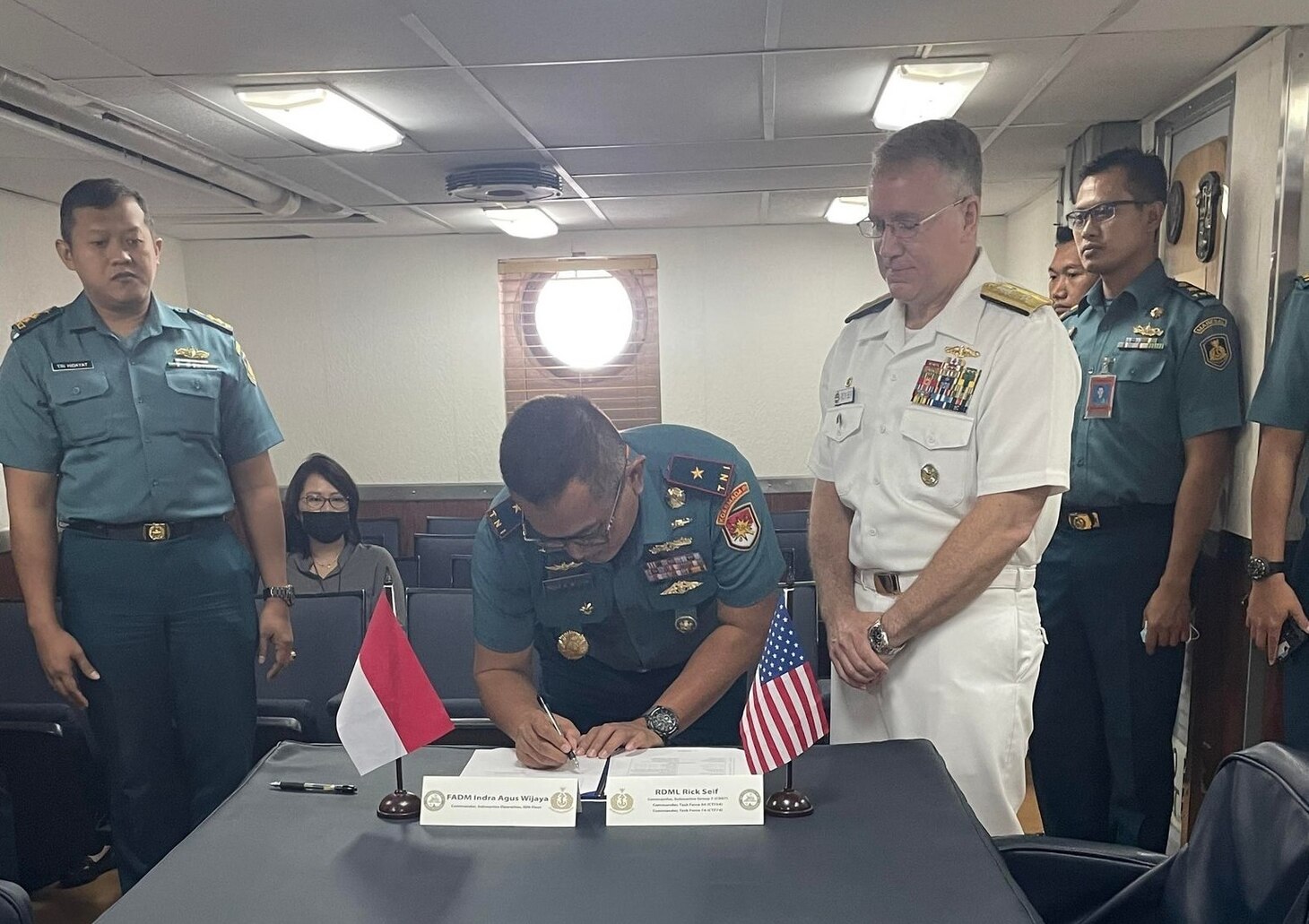 JAKARTA, Indonesia (July 22, 2022) – U.S. Navy Rear Adm. Rick Seif, commander, Submarine Group 7/Task Force 74 signs the 6th Indonesian National Military-Naval Force and U.S. Navy Submarine Force Staff Talks action items aboard the Emory S. Land-class submarine tender USS Frank Cable (AS 40) in Jakarta, Indonesia, July 22, 2022. Submarine Group 7 directs forward-deployed, combat capable forces across the full spectrum of undersea warfare throughout the Western Pacific, Indian Ocean, and Arabian Sea. (Photo courtesy of Lt. Haley Bonner)