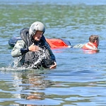 U.S. Air Force Col. Lee Bouma, the 173rd Fighter Wing commander, wades out of the water following his circuit through several water survival training scenarios prepared by 173rd FW Aircrew Flight Equipment at Cultus Lake in Central Oregon, July 16, 2022.