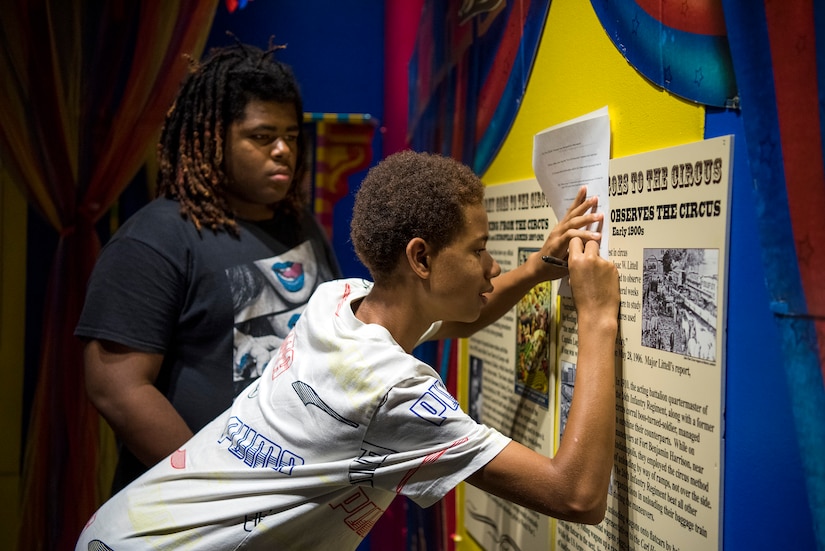 High school students tour a museum during summer camp.