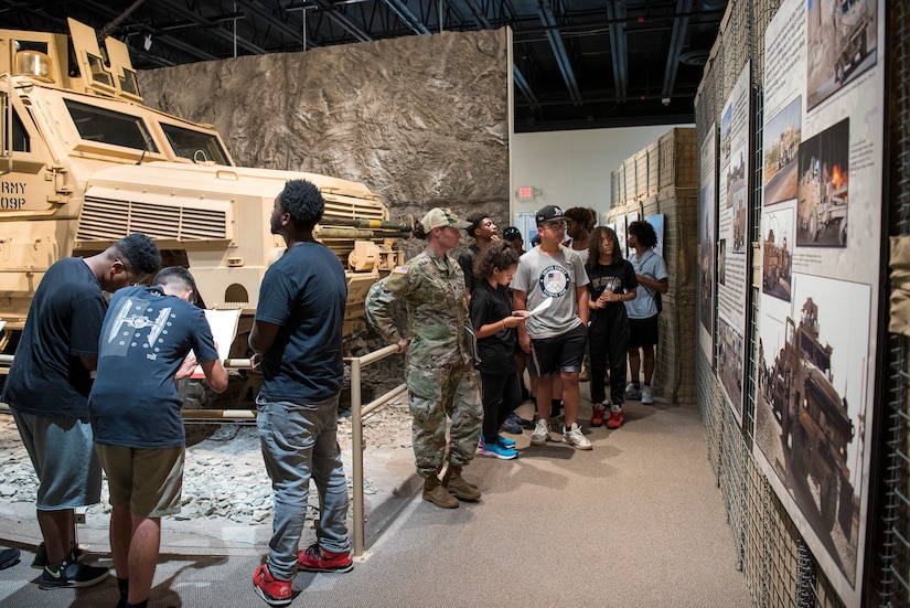 High school students tour a museum during summer camp.