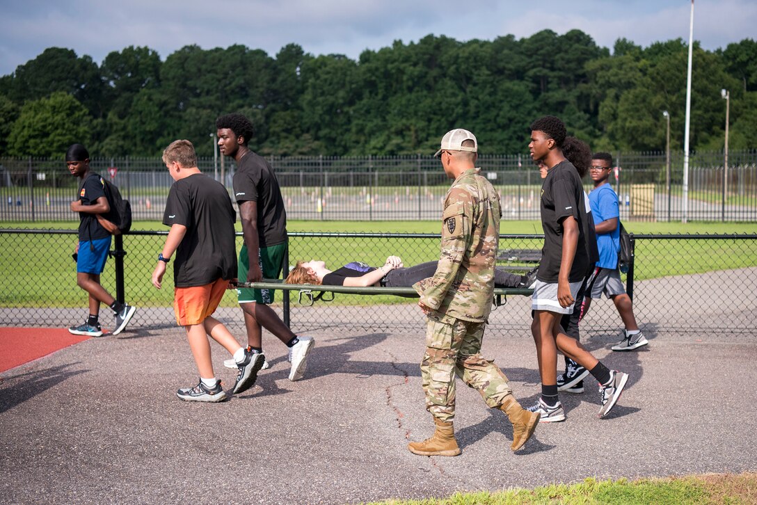 High school students work on a task during summer camp.