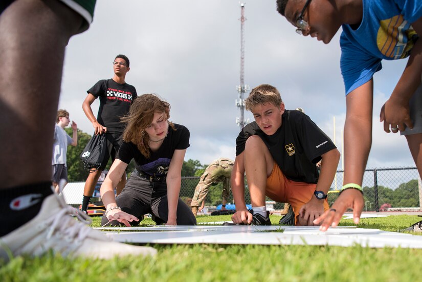 High school students work on a task during summer camp.