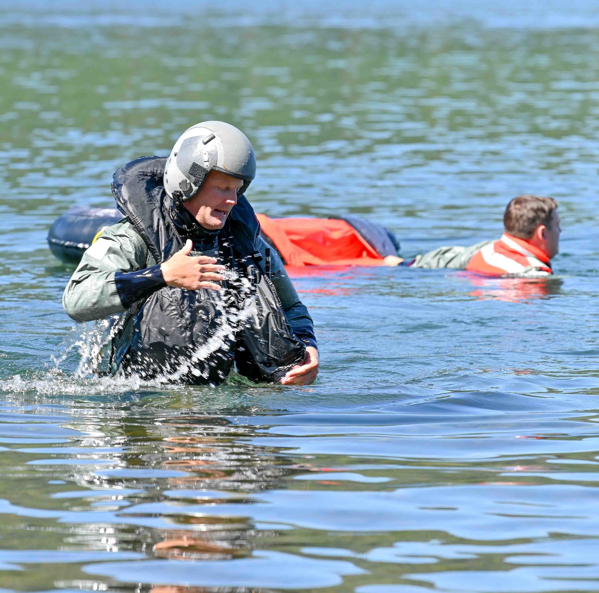 U.S. Air Force Col. Lee Bouma, the 173rd Fighter Wing commander, wades out of the water following his circuit through several water survival training scenarios prepared by 173rd FW Aircrew Flight Equipment at Cultus Lake in Central Oregon, July 16, 2022.