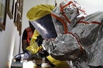 U.S. Army Sgt. Tiffany Zumaya and Sgt. Thomas Brown from the 9th Civil Support Team examine evidence during a training exercise at Joint Forces Training Base, Los Alamitos, Calif., July 14, 2022.