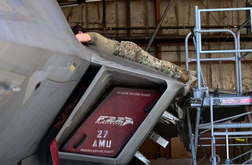 SPECS Airman gives a tour of an F-22 Raptor