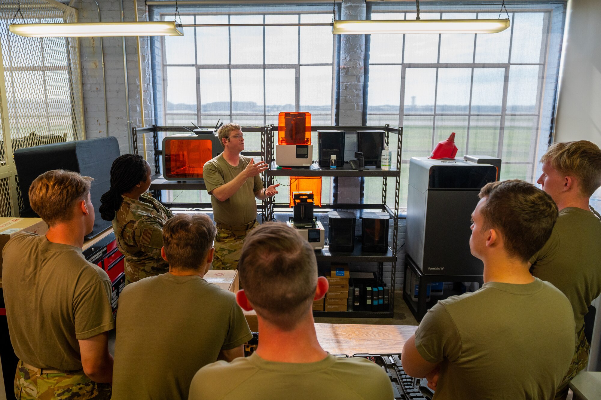 Captain Jeff Howdeshell, 22nd Air Refueling Wing chief of innovation lab, teaches a group of United States Air Force Academy cadets about the different projects at the lab July 21, 2022, at McConnell Air Force Base, Kansas.
