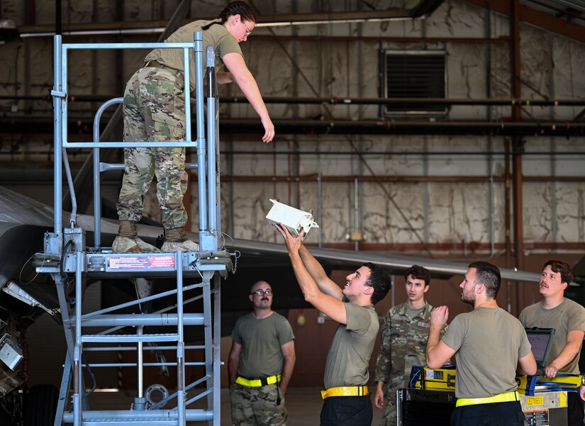 SPECS Airman gives a tour of an F-22 Raptor