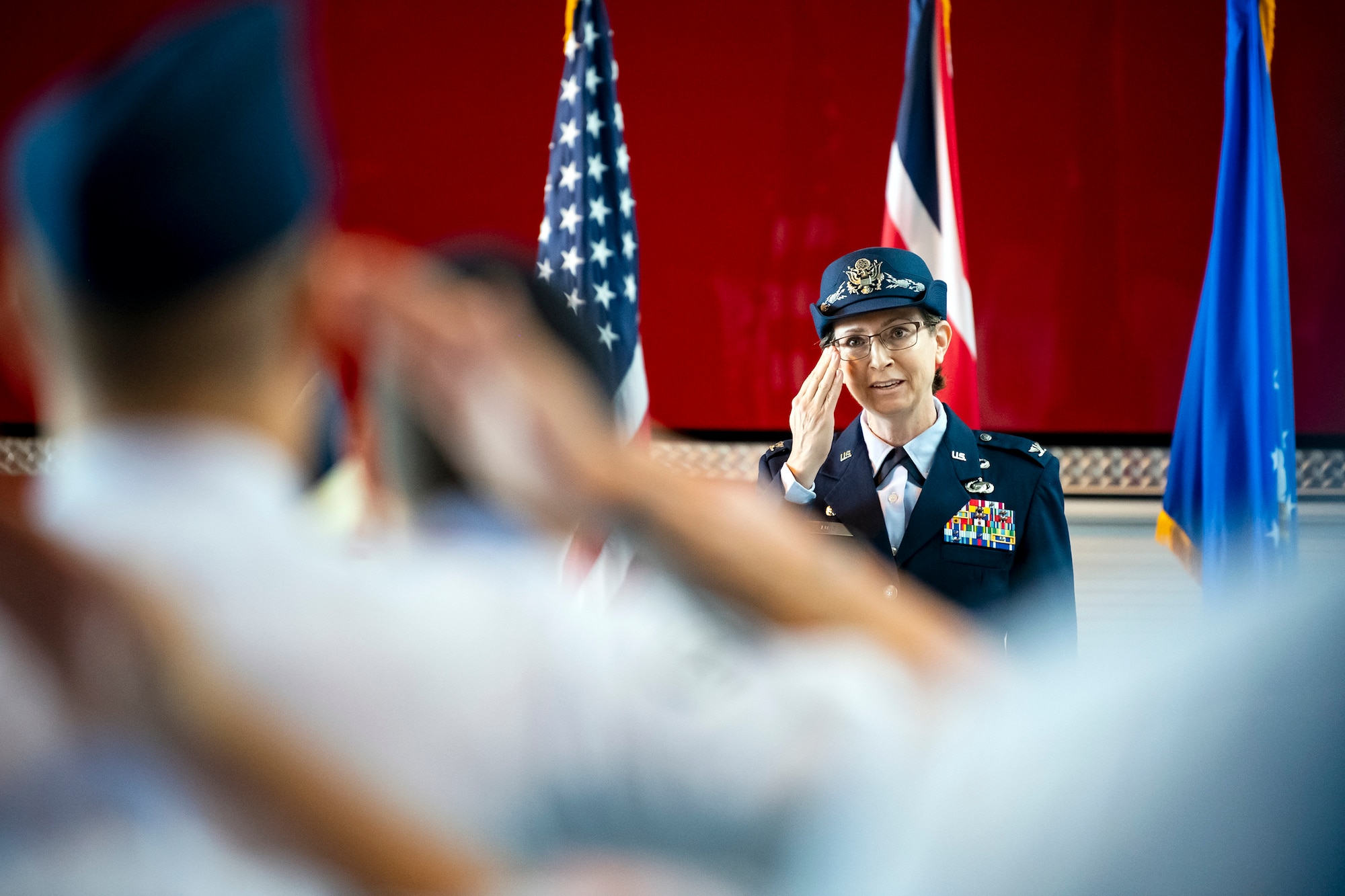 U.S. Air Force Col. Valarie Long, 423d Air Base Group incoming commander, renders her first salute as commander during a change of command ceremony at RAF Alconbury, England, July 25, 2022. Prior to assuming command, Long served as the Director of Information Warfare at the 603d Air Operations Center, Ramstein AB, Germany. (U.S. Air Force photo by Staff Sgt. Eugene Oliver)