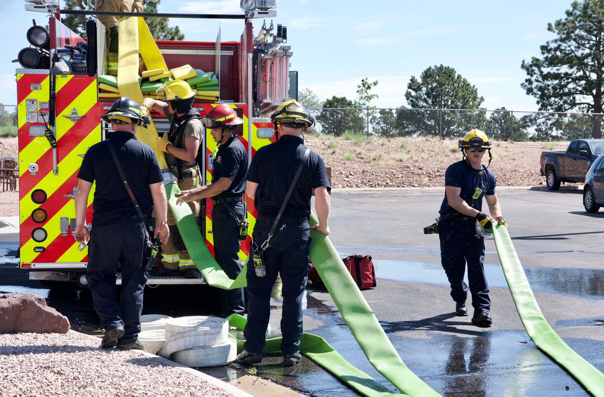 Men use fire hose.