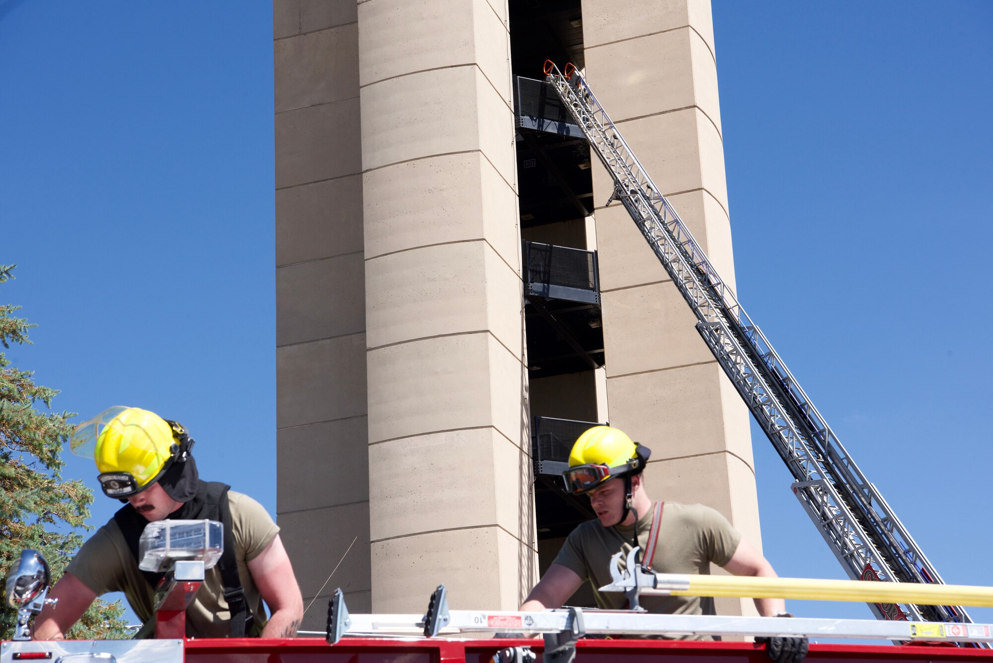 Men on firetruck.
