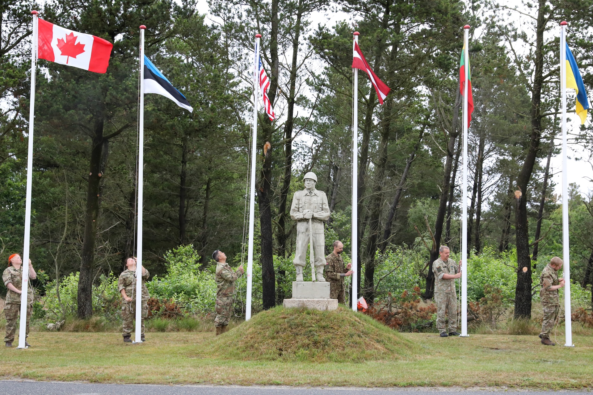 Participants for MREP 2022 work together on team building exercises at Camp Nymindegab July 7, 2022. MREP is a program that houses almost 130 participants from 6 different nations, to increase interoperability, strengthen partnerships, and to enhance professional development between allies.