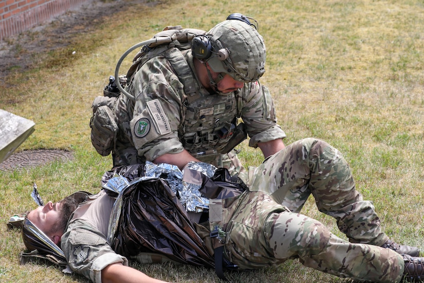 Participants for MREP 2022 work together on team building exercises at Camp Nymindegab July 4, 2022. MREP is a program that houses almost 130 participants from 6 different nations, to increase interoperability, strengthen partnerships, and to enhance professional development between allies.