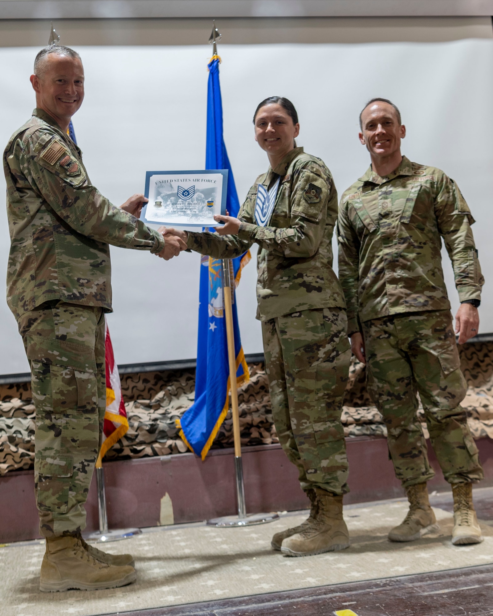 The 332d Air Expeditionary Wing celebrates with an E-6 release party for those Airmen selected to promote to Technical Sergeant at an undisclosed location in Southwest Asia, July 23, 2022. 332d AEW Commander Brigadier General R. Ryan Messer along with Command Chief Master Sergeant Kevin M. Eberlin help celebrate the occasion. Promotion to TSgt is very competitive, this year the promotion rate is only 16%. Promotions exemplify technical skills, leadership, and a standard of excellence. (U.S Air Force photo by Tech. Sgt. Jeffery Foster)