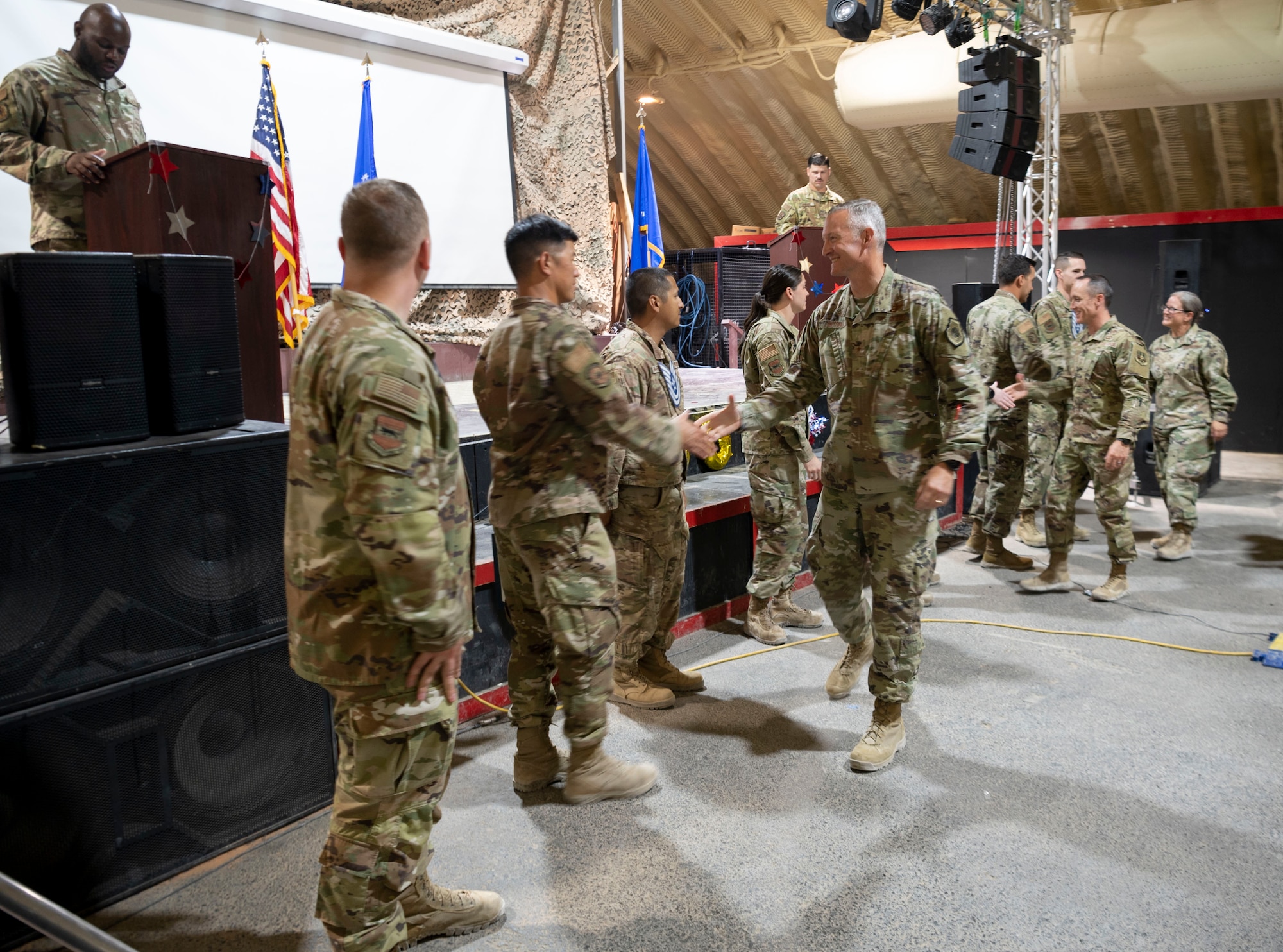 The 332d Air Expeditionary Wing celebrates with an E-6 release party for those Airmen selected to promote to Technical Sergeant at an undisclosed location in Southwest Asia, July 23, 2022. 332d AEW Commander Brigadier General R. Ryan Messer along with Command Chief Master Sergeant Kevin M. Eberlin help celebrate the occasion. Promotion to TSgt is very competitive, this year the promotion rate is only 16%. Promotions exemplify technical skills, leadership, and a standard of excellence. (U.S Air Force photo by Tech. Sgt. Jeffery Foster)